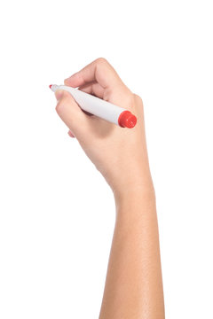 Female hand holding a red marker isolated on white background