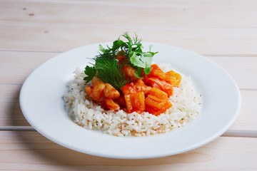 Plate with rice, chicken fillet and bell pepper