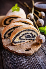 Poppy seed strudel sprinkled with powdered sugar