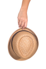 Hand of the woman who was holding a Hat Isolated on white background