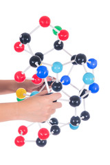 Hand holding colorful science molecule model isolated on white background