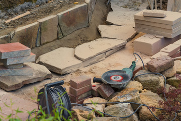 Craftsman works with an electric grinding machine