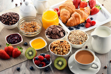 Breakfast served with coffee, juice, croissants and fruits