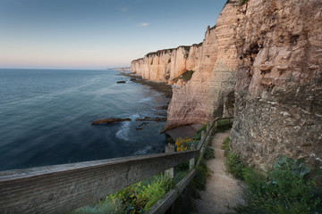 Fototapeta na wymiar The walkway down to the pebble beach the other side of Porte d’Amont at Etretat, Normandy, France