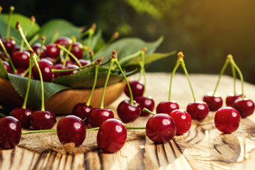 Cherries in basket on wooden table.Cherry. Cherries in bowl. Red cherry. Fresh sweet cherries with water drops,Close up.healthy food concept,soft focus