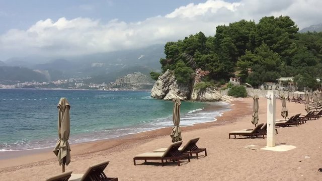 Luxury sandy beach with pink sand and blue water sea calm landscape. Beautiful beach with nobody. Sunny day summer destination vacation paradise place.