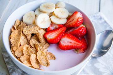 Healthy Breakfast which included cornflakes and oatflakes, yogurt, bananas and strawberries