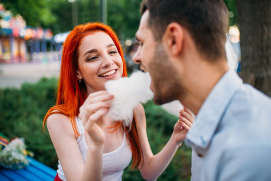 Woman Feeding Man Cotton Candy, Romantic Date