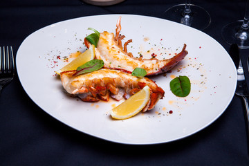 Lobster tail in maple-truffle sauce with lemon and basil