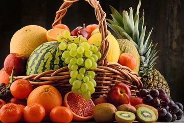 Fototapeten Composition with assorted fruits © monticellllo