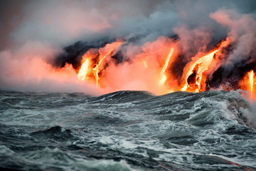 Molten lava flowing into the Pacific Ocean on Big Island of Hawaii at sunrise © Allen.G