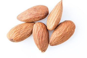 peeled almond seed on white background