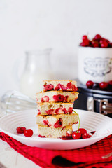 Cake, dessert and pastries, biscuit pie with cherry, raspberries and milk on a light background 