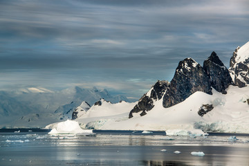 Icebergs, glaciers and mountains along the Antarctic Peninsula.