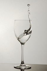 Wine glass with water splash