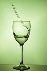 Wine glass with water splash