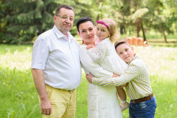 Fototapeta premium Happy family in green pak