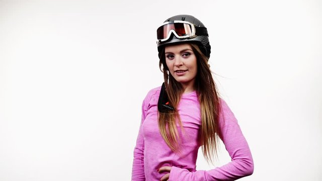Woman fit female wearing ski gear and pink thermal underwear long sleeves top apparel for skiing training. Clothing sport wear concept, on white studio shot, full HD