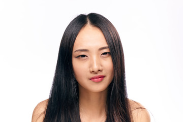 Fototapeta premium Beautiful young woman on white isolated background, portrait, asian