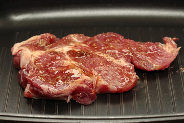 Homemade cooking , Pork steak in pan for served.
