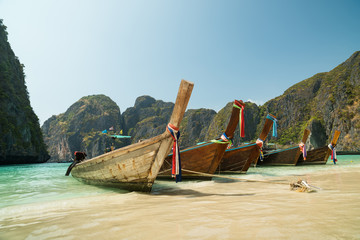 Traditional tourist boats. Maya bay, Phi Phi Lee island. Travel to Thailand. Thailand's most...