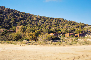 Beach houses on the shore.