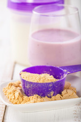 Protein and milk for milkshake. Sports food. Selective focus.