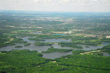 Fototapeta na wymiar aerial view of green land with lake and grassland
