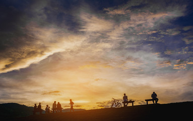 Fototapeta na wymiar silhouette of people in sunset time
