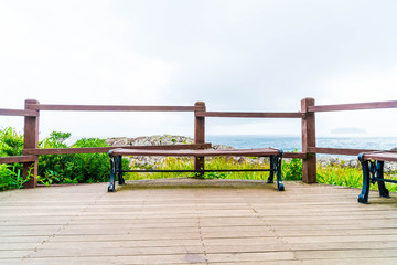 Fototapeta na wymiar empty bench at Seaseom Park in Jeju Island