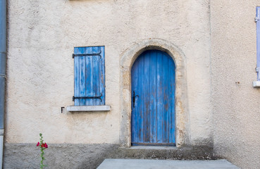 Fototapeta na wymiar Provence style blue wooden doors and window shutters