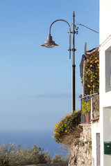 Fraction of house with light post against blue sky, Amalfi, Amalfi coast, Italy