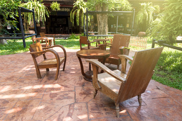 Obraz premium Wood chair at garden in relaxing time.