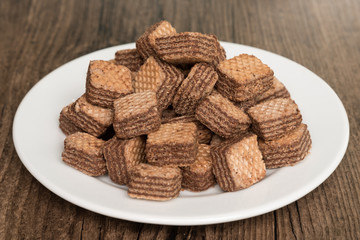 Chocolate Wafers on white plate.