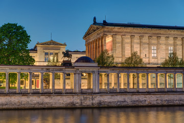 Fototapeta na wymiar The Old National Gallery with the river Spree in Berlin at night