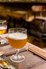 Drinking beer in the pub and restaurant cafe with blur bar background at night.