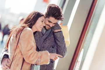 Young couple enjoying shoping in the city