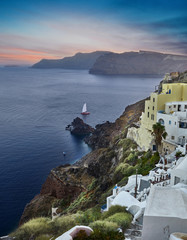 Fototapeta premium Santorini island traditional houses at sunset. Famous Santorini island, Oia town, Greece