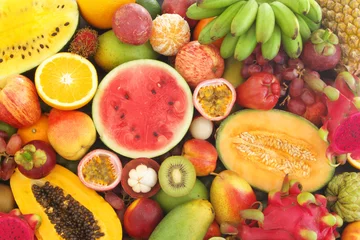 Zelfklevend Fotobehang Many tropical fruits mixed together, fruit background © Valerii Evlakhov