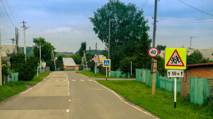 rural houses along the road © niklan