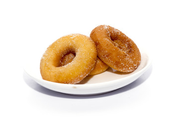 donut on white plate isolated on white