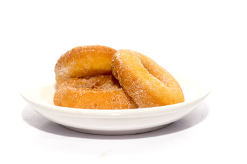 donut on white plate isolated on white