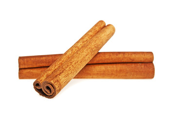 Two cinnamon sticks spice isolated on a white background, closeup
