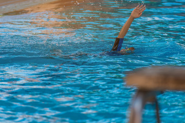 asian boy at swimming pool .