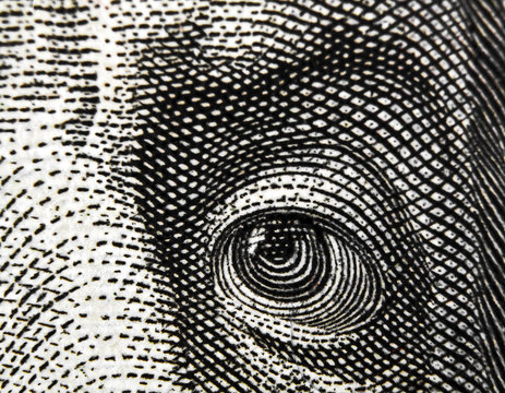 Fragment of $100 banknote. Eye.