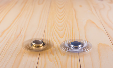 hand with spinner on table.
