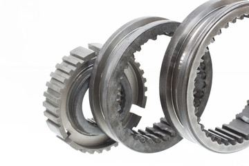 automobile transmission gear shafts on a light background