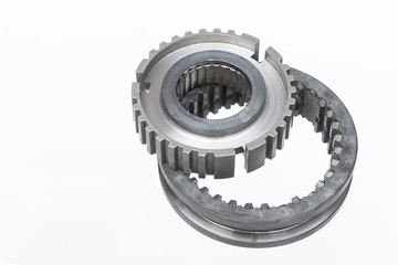 automobile transmission gear shafts on a light background