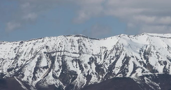 Mount Nebo Utah heat mirage snow clouds fast motion. Wasatch Mountain range fast moving clouds on horizon of pine forest. Beautiful nature landscape. Uinta National Forest and wilderness area.