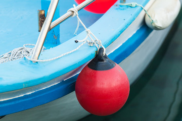 Red buoy for protecting moored yachts in marina